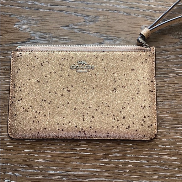 Coach Handbags - Rose gold Coach wristlet